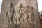 Hampi Vittala Temple pillar carving of mythical characters along with a human