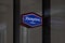 Hampton by Hilton hotel sign. Logo is reflecting in the window.