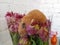 Hamster eats flowers from a bouquet