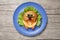 Hamster made of bread and vegetables on table