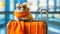 A hamster wearing sunglasses and a scarf on top of an orange suitcase, AI