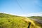 Hamuka Coast, Hawaii rolling green farmland above coastline under blue sky