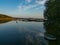 Hancza Lake, the deepest lake of the Poland. Sunny day, late afternoon, sky reflecting in the water.