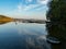 Hancza Lake, the deepest lake of the Poland. Sunny day, late afternoon, sky reflecting in the water.