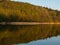 Hancza Lake, the deepest lake of the Poland. Sunny day, late afternoon, sky reflecting in the water.