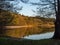 Hancza Lake, the deepest lake of the Poland. Sunny day, late afternoon, trees reflecting in the water.