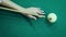 Hand aiming and hits the ball of russian billiards.