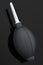Hand air blower bulb for camera isolated on black background.
