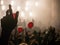 Hand in the air during rock concert silhouetted against bright lights