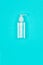 Hand alcohol sanitizer gel on blue background