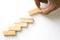 Hand aranging wood block stacking as step stair.