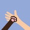 Hand arm holding cat dog paw print leg foot. Close up. Help adopt animal pet donate concept. Friends forever. Veterinarian care.