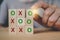 hand arranged wooden cube blocks, tic tac toe XO game, for business strategy, success concept