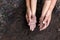 Hand of an asian mother and girl Both hands were holding the black soil in their palms. Is to prepare the soil for planting