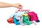 Hand with assorted clothes, loundry housework. Isolated