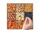 Hand with assorted nuts and dried fruit collection. Different superfoods. Vegetarian snack of different nuts. organic mixed nuts