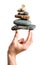 Hand balancing the zen stone pyramid