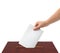 Hand with ballot and box