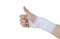 Hand with bandage after surgery thumb up on white background
