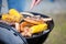 Hand Barbecuing Meat And Corn