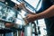 Hand of a barista holding a stainless mug