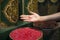 Hand of a beautiful woman in a store selling spices enjoying the same in the Jemaa el Fna square in the city of Marrakech in