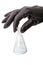 Hand in black glove with chemical glass bulb
