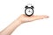 Hand with black retro alarm clock, classic watches with bells