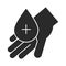 Hand with blood drop medical charity donation and love silhouette icon