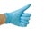 Hand in blue rubber glove thumb up on white background