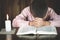 Hand boy praying In the room and lit candles to light , Hands folded in prayer concept for faith, spirituality and religion