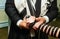 Hand of boy reading the Jewish Torah Bar Mitzvah