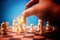 The hand of businessman holding brown king chess and checkmate competitor and win the games. Concept of leadership must have a