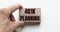 Hand of a businessman holding wooden blocks. Conceptual image. Text 401k planning concept business succeed
