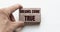 Hand of a businessman holding wooden blocks. Conceptual image. Text DREAM COME TRUE concept business succeed