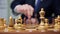 Hand of businessman moving chess figure in competition success play. strategy, management or leadership concept