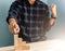 Hand of a businessman point at the top stacking of wood cubes