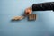 Hand of a businessman stopping collapsing dominos in a conceptual image of crisis management