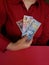 hand of a businesswoman holding australian banknotes