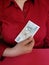 hand of a businesswoman holding a czech banknote