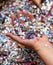 Hand with carnival confetti and money