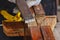 The hand of the carpenter taking the chisel to sharpen the wood plank