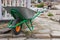 A hand cart with a wheel for garbage collection