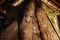 hand carved ceremonial tribal tamtam drums resting in a traditional bamboo building