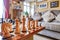 Hand-carved chess pieces and board seen within a private house.