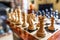 Hand-carved chess pieces and board seen within a private house.