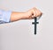 Hand of caucasian young catholic woman holding christian cross over isolated white background