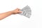 Hand of caucasian young man holding bunch of dollars banknotes over isolated white background