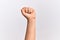 Hand of caucasian young woman doing protest and revolution gesture, fist expressing force and power