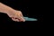 Hand ceramic kitchen knife on a black background